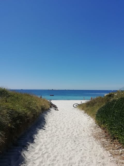 On the beach, sun loungers, beach towels