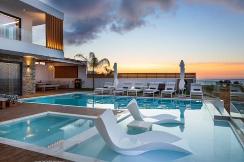 A heated pool, sun loungers