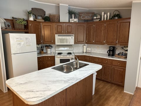 Open and bright kitchen well-equipped with everything needed to prepare meals.