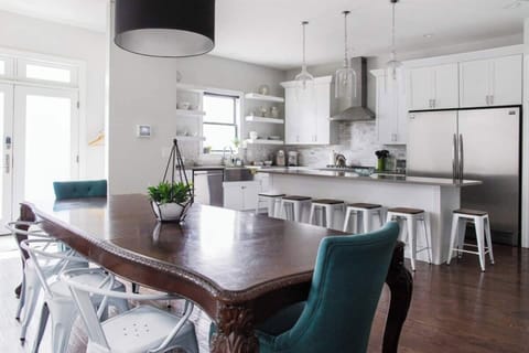 Dining Room seats 8 with another 6 seats at the kitchen island. 2 extra dining chairs provided.