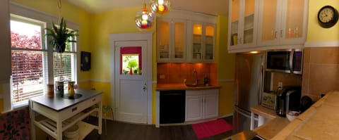 The kitchen with lit up cabinets.