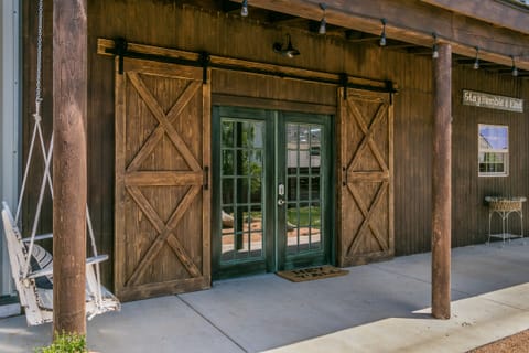 French doors entering barn with barn doors on top