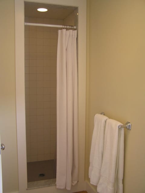 The shower is white tile.