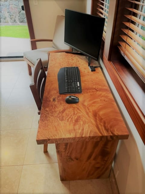 Ideal for digital nomads, this custom wood desk setup keeps you productive in an inspiring setting.