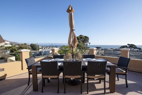 This outdoor dining on the deck is located right off the kitchen