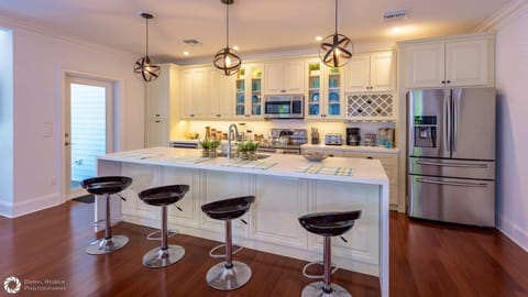 The large kitchen island offers additional dining for four...