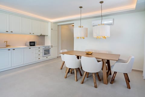 Fully equipped kitchen with wine cooler.