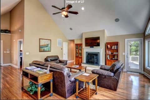Great room has 55 inch smart TV with surround sound on deck and screen porch.