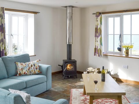 Welcoming living area with wood burner | The Old Dye House, Hallin