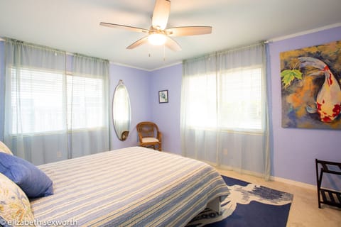 Large bedroom in the front of the house with a queen bed