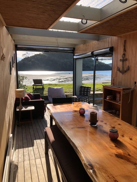 Heated indoor/outdoor seating area with large dining table - amazing views