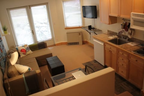kitchen and living space.  2 burner stove, hi speed wifi and flat screen.  
