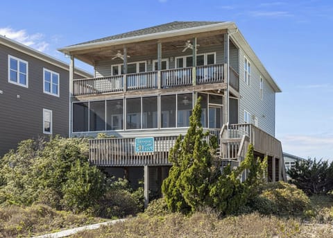 Beach house with sheltered area under house & plenty of parking on back driveway