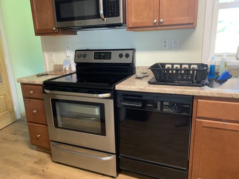 Full kitchen with electric oven stove, dish washer, microwave 
