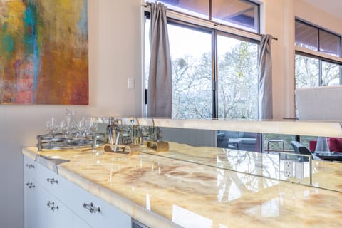 Upstairs Wet Bar, wine fridge.  Beautiful feature bar with backlit Onxy Stone!