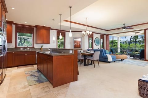 Full kitchen with breakfast bar, granite counters, and stainless steel appliances