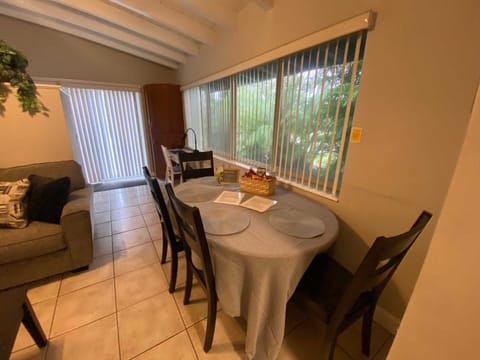 Dining table seats up to six with extra chairs.
