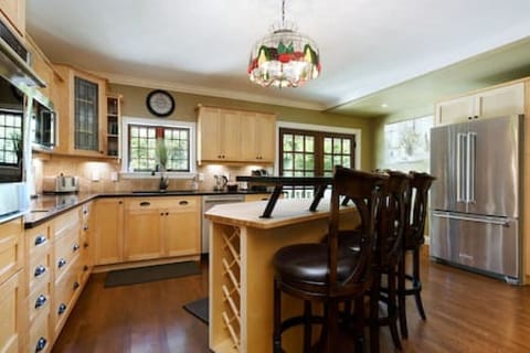 Maple shaker kitchen cabinets with top of the line stainless steel appliances and induction cook top.