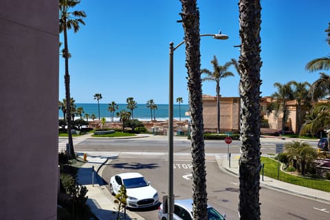 infront of balcony/side street on Sportfisher side