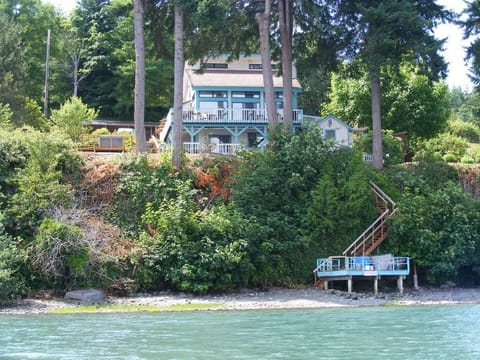 View of home from the private beach, grab a kayak and explore Hood Canal!