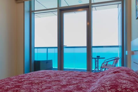 Master bedroom floor to ceiling views of the ocean.
