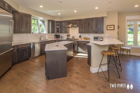 Open Concept Kitchen With Stainless Steel Appliances