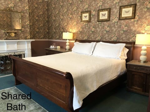Room 3: King bed, adjoins room 4 as a suite, private unattached 1.5 bath, 2nd fl