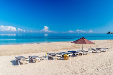 On the beach, sun loungers, beach towels