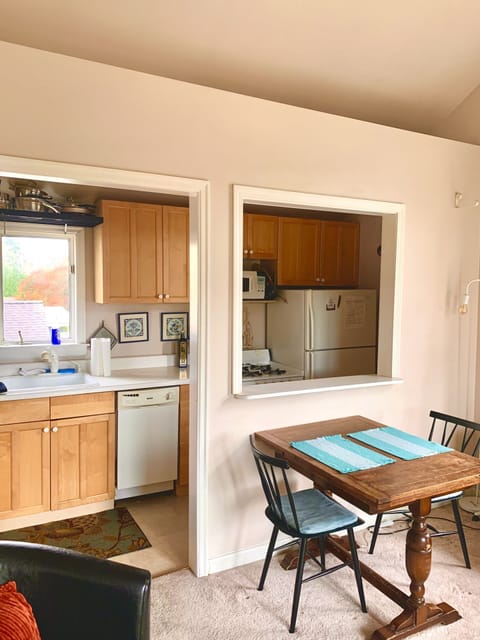 Kitchen, view from the ‘great room’, with expandable  dining table 
