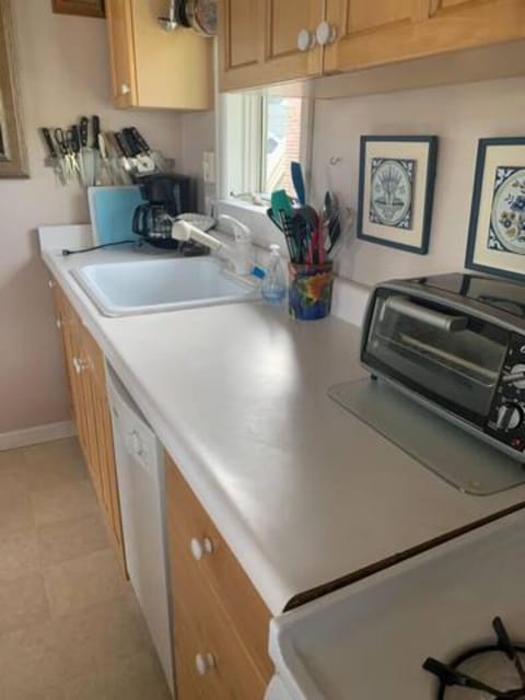 Full kitchen: gas stove, dishwasher, full size refrigerator, dishes, pots, pans