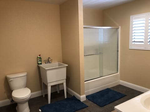 Combined shower/tub, hair dryer, towels, soap