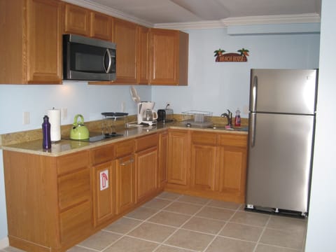 Fridge, microwave, stovetop, coffee/tea maker