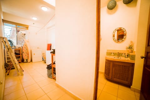 Utility room with washing machine and washroom