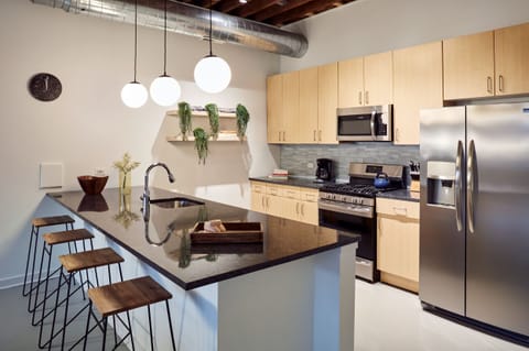 Gourmet kitchen #1 - With gas range, stainless appliances, and large granite island