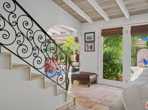Wrought iron stairs off Family Room leading to 4 bedrooms