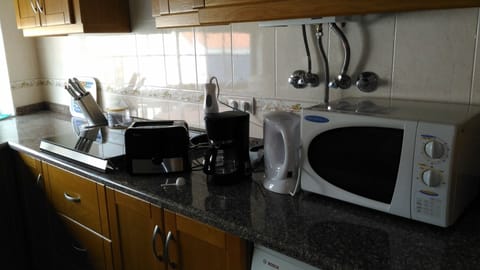 Microwave, coffee/tea maker, cookware/dishes/utensils