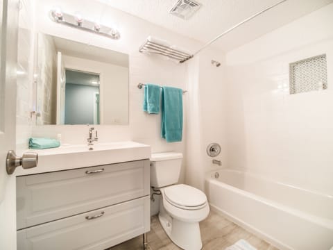 Combined shower/tub, hair dryer, towels, soap