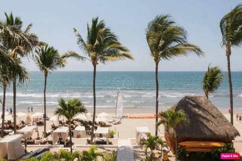 On the beach, sun loungers, beach towels