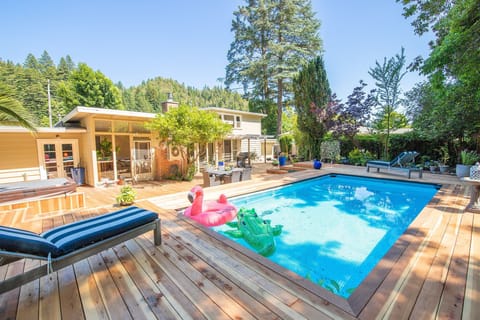 1200 square foot deck with pool and hot tub