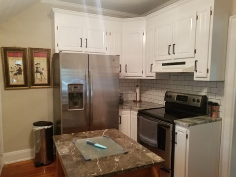 Kitchen with all new subway tile and granite countertops and plumbing !