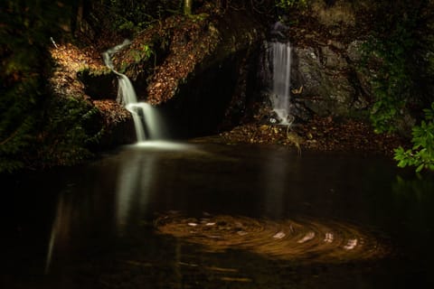 Floodlit 5 metre waterfalls at night
