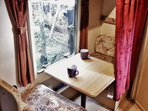 converts to 1 or 2 bunk beds. Curtain shown only partly pulled across