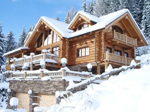 The Chalet is perched high in the Austrian alps in a forested area next to  lift station.