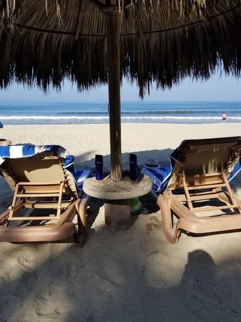 On the beach, sun loungers, beach towels