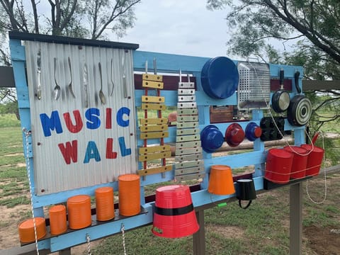 create music in nature at our interactive music wall at The Lazy Buffalo Cabins