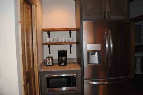 full sized fridge and coffee bar