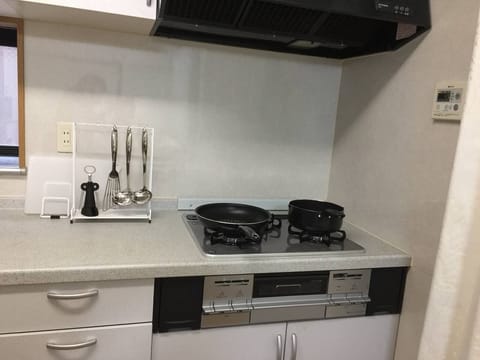 Fridge, microwave, coffee/tea maker, cookware/dishes/utensils