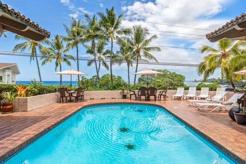 View from house across pool to the ocean, where you can enjoy beautiful sunsets