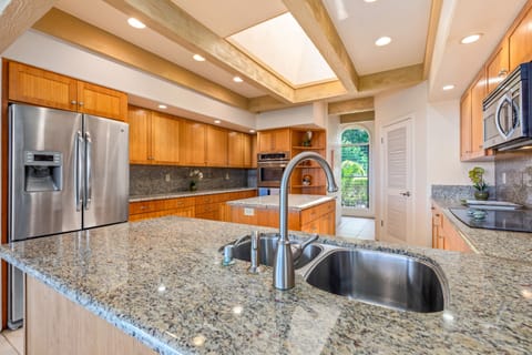 Main kitchen is large with skylight and island with even a double oven.