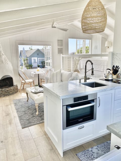 Open concept kitchen & living room with high beam ceilings &
 breezes throughout